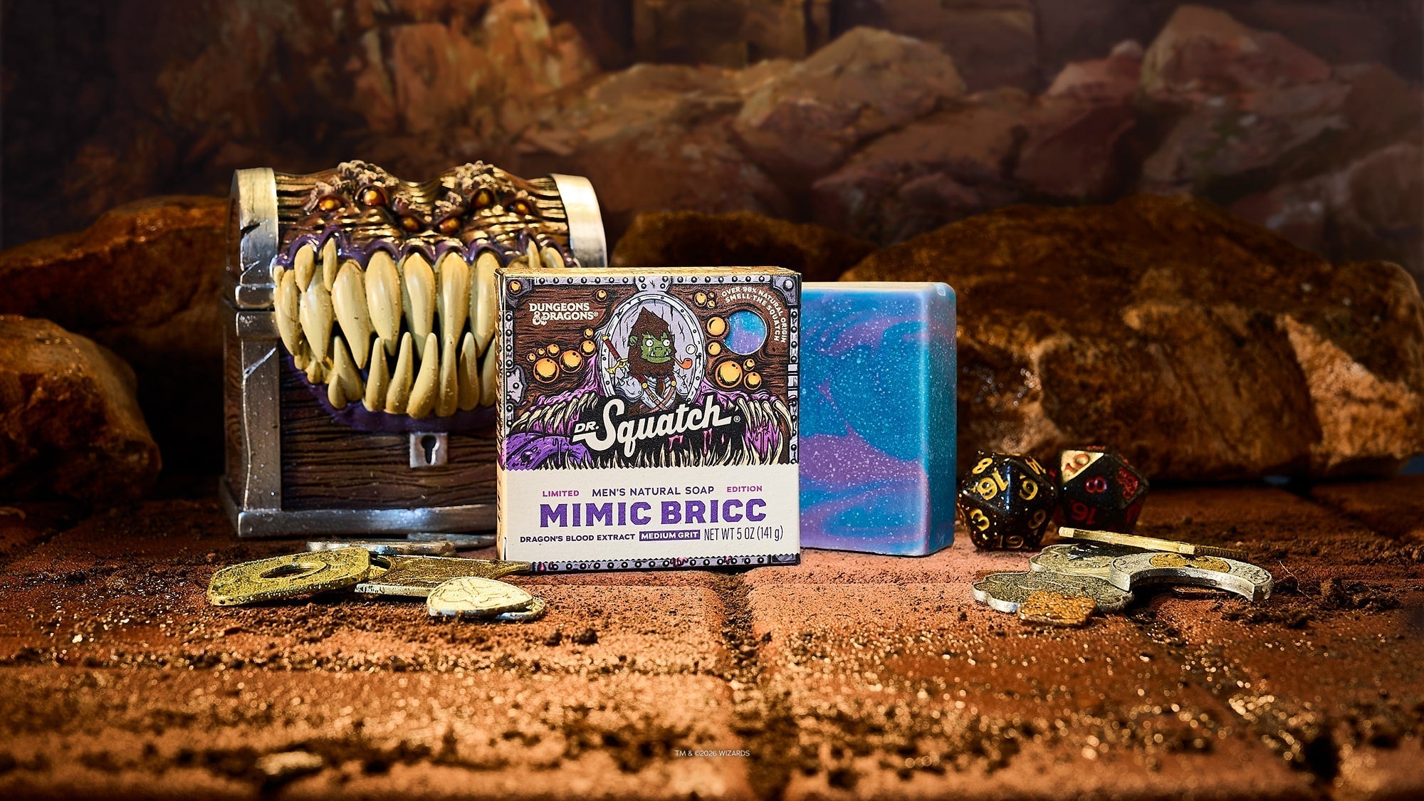 Dungeons & Dragons Mimic Bricc soap bar displayed with decorative treasure chest and dice on sandy surface.